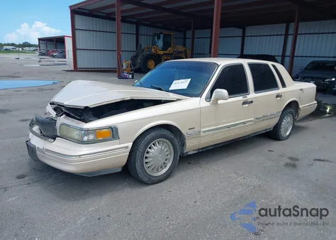 1996 Lincoln Town Car Cartier z USA, uszkodzony, nr VIN 1LNLM83W7TY634343